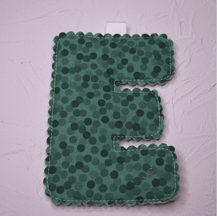Scolloped letter - E